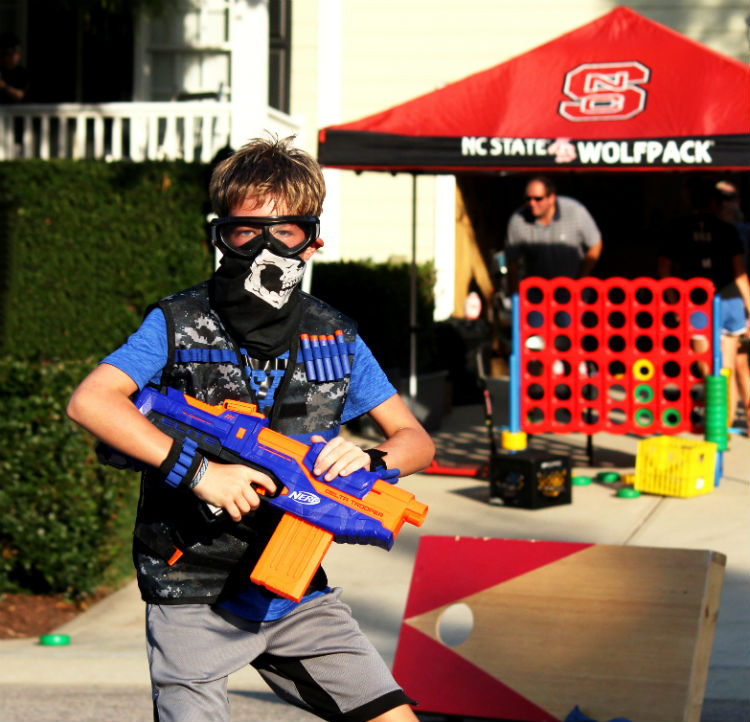 Kid in Nerf Gear With other games in background