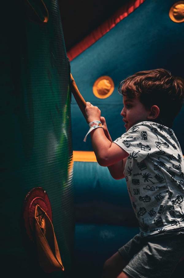 A child plays on a party inflatable